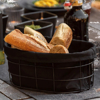 Bread basket storage in black outdoor kitchen